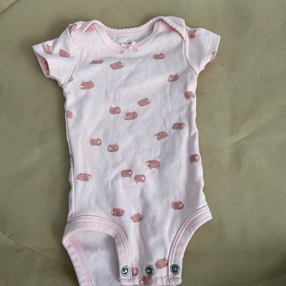 pink onesie with sheep